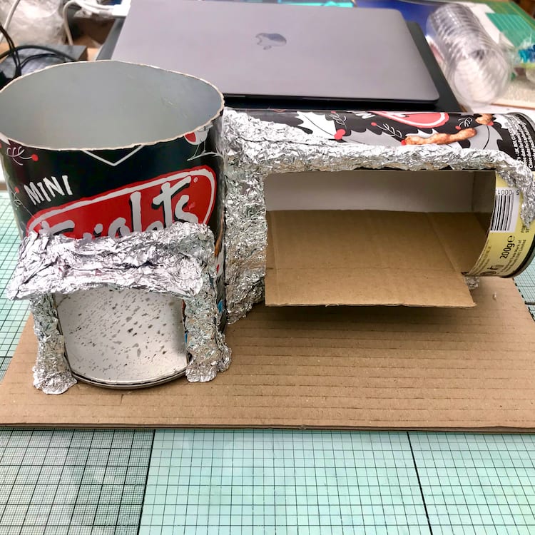 Using aluminium foil to mould the shape of the eaves.